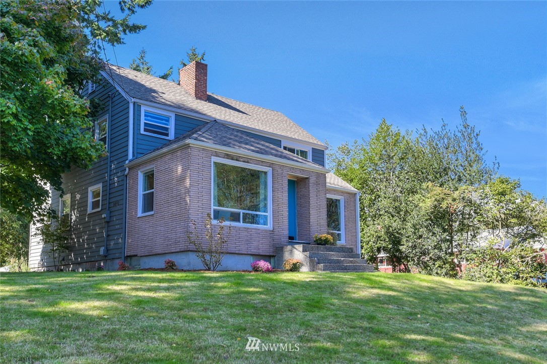 5802 Cady Road Everett, WA 98203 - Photo 1 of 25 a front view of a house with a garden
