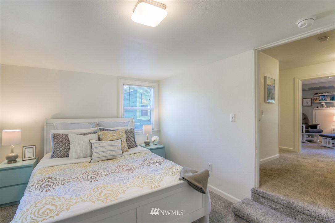 5802 Cady Road Everett, WA 98203 - Photo 16 of 25 a bedroom with a bed and a view of living room
