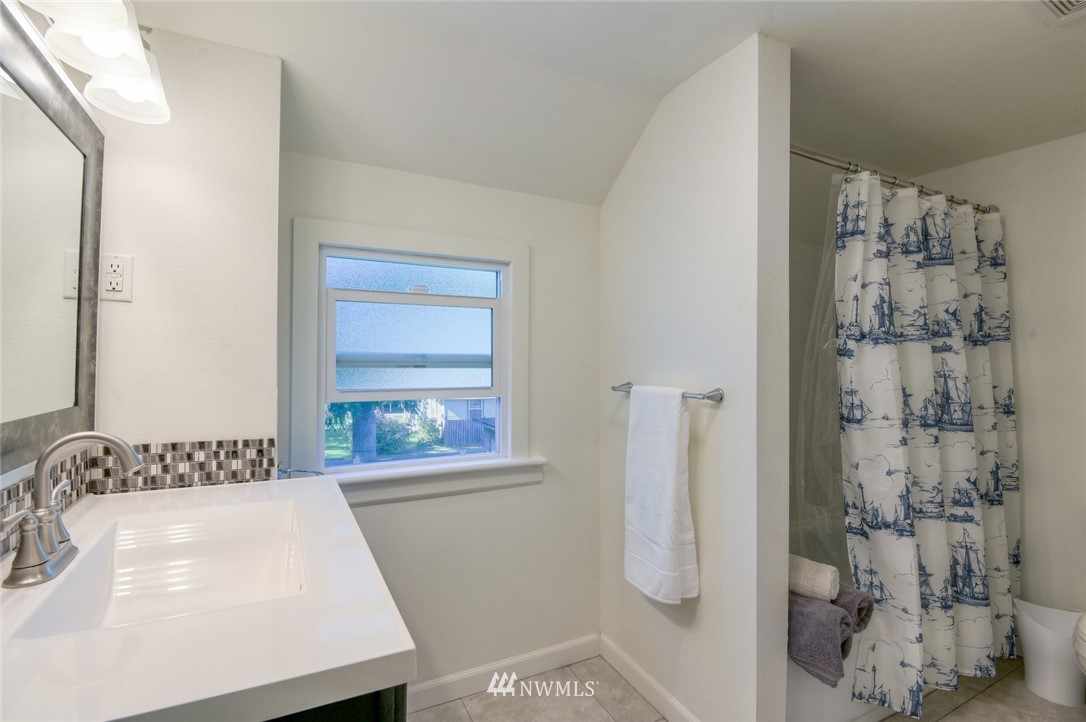 5802 Cady Road Everett, WA 98203 - Photo 17 of 25 a bathroom with a sink a toilet and shower