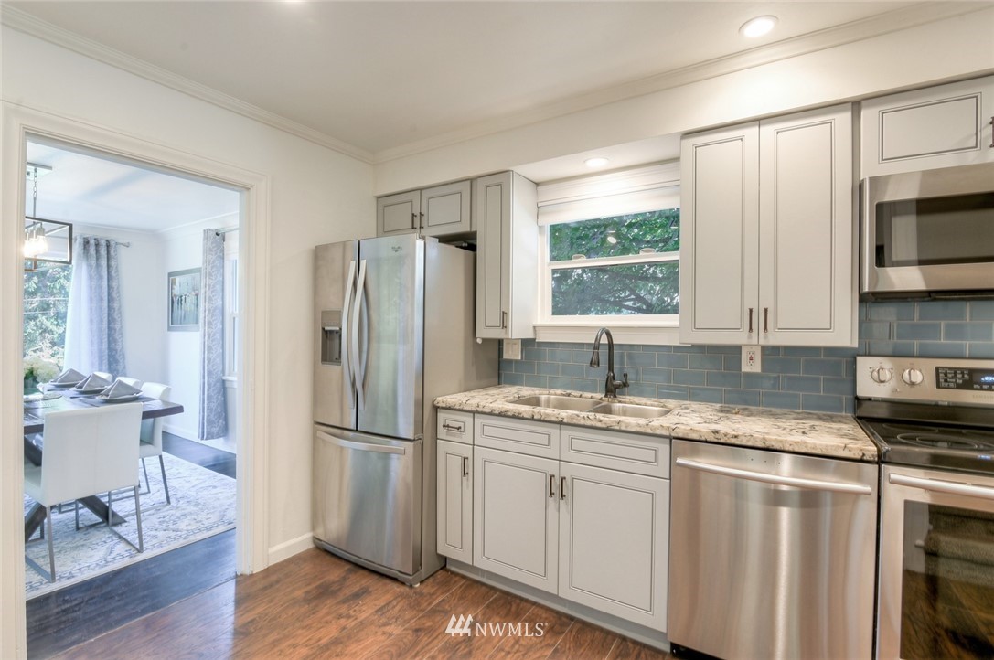 5802 Cady Road Everett, WA 98203 - Photo 7 of 25 a kitchen with a refrigerator and a sink