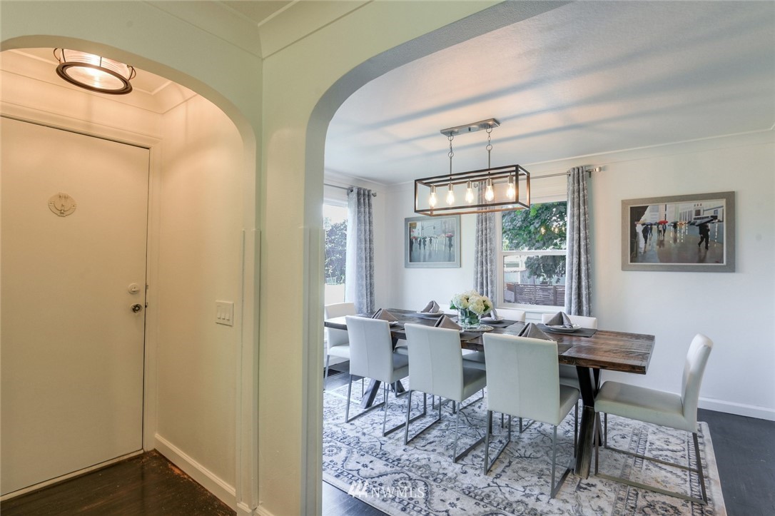 5802 Cady Road Everett, WA 98203 - Photo 8 of 25 a view of a dining room with furniture a chandelier and wooden floor