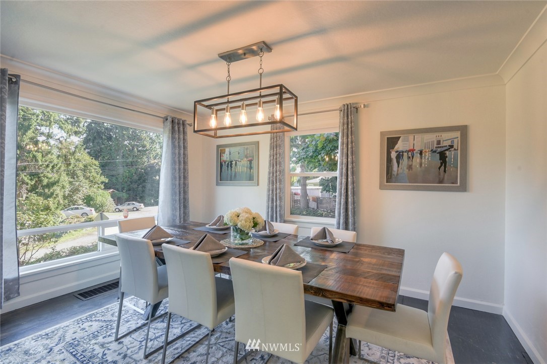 5802 Cady Road Everett, WA 98203 - Photo 10 of 25 a dining room with furniture a chandelier and wooden floor