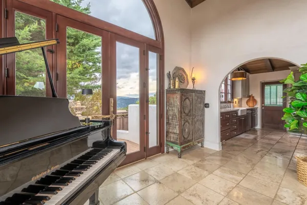 a room with furniture and large windows