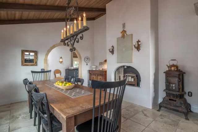 a view of a dining room with furniture and chandelier