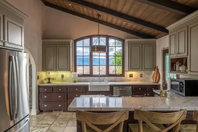 a kitchen with a stove a sink and a refrigerator