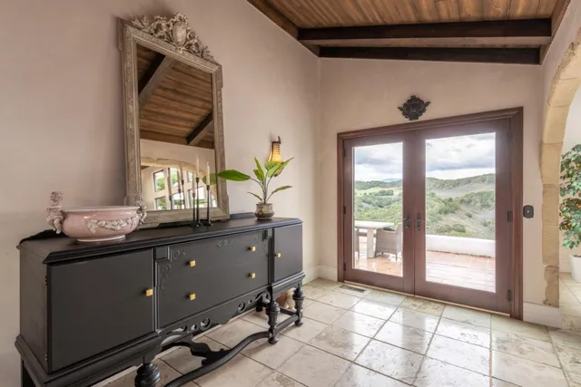 a room with window and view of living room