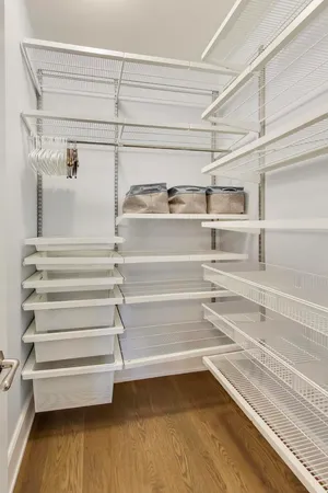 a bedroom with a bed and a walk in closet