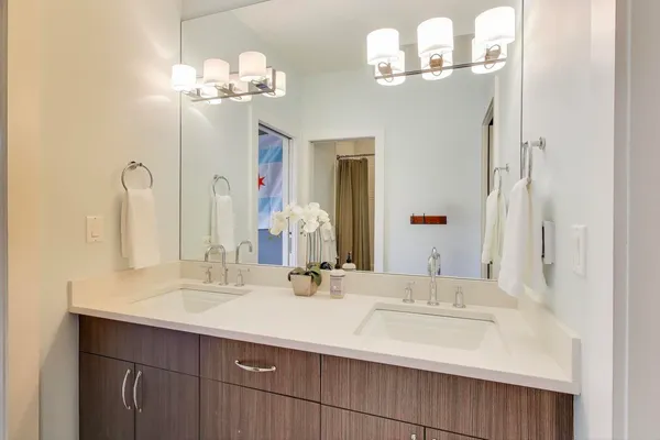 a utility room with stainless steel appliances and cabinets