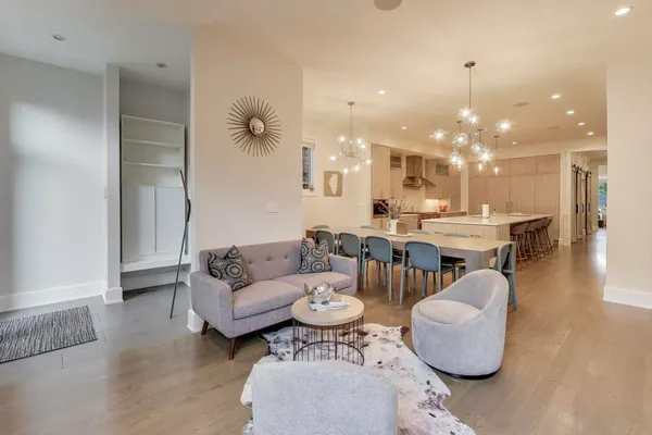 a kitchen with stainless steel appliances kitchen island granite countertop a kitchen island a stove and a sink