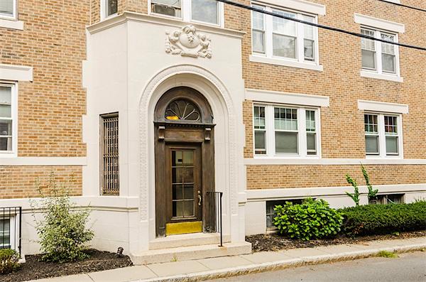 5 Colliston Road, Unit 1 Boston, MA 02135 - Photo 1 of 11 a front view of a house with a garden