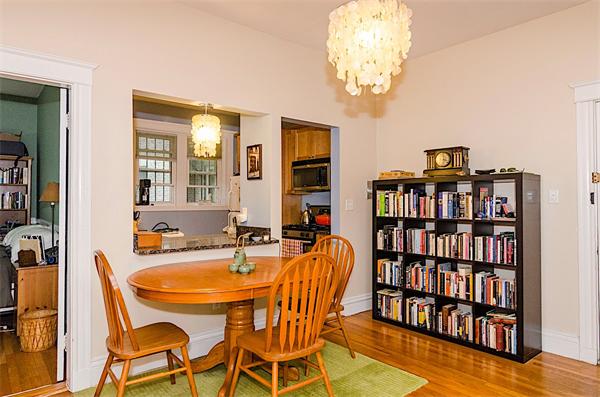 5 Colliston Road, Unit 1 Boston, MA 02135 - Photo 2 of 11 a dining room with furniture and chandelier