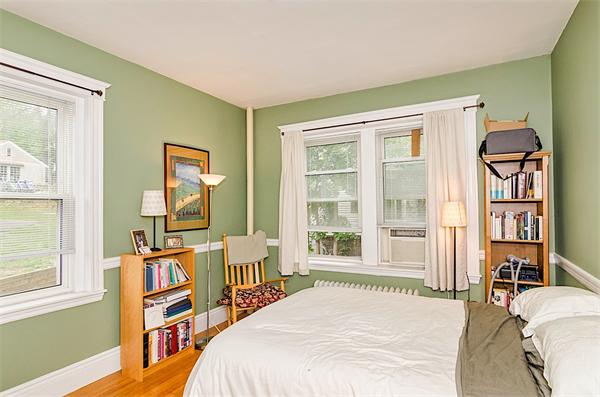 5 Colliston Road, Unit 1 Boston, MA 02135 - Photo 7 of 11 a bedroom with a bed and a window