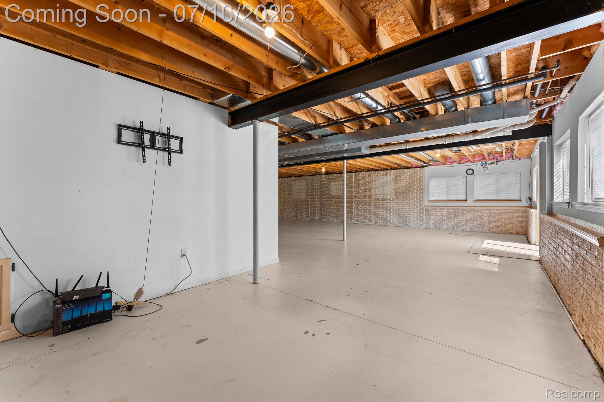 3144 North Nicholson Road Fowlerville, MI 48836 - Photo 67 of 70 Expansive unfinished basement featuring concrete flooring and exposed ceiling joists