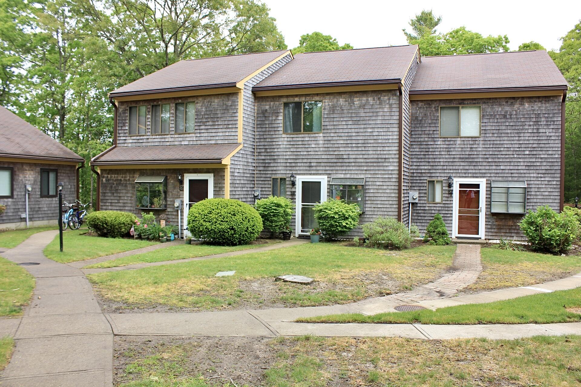 25 Round House Road Bourne, MA 02532 - Photo 1 of 32 a front view of a house with a yard