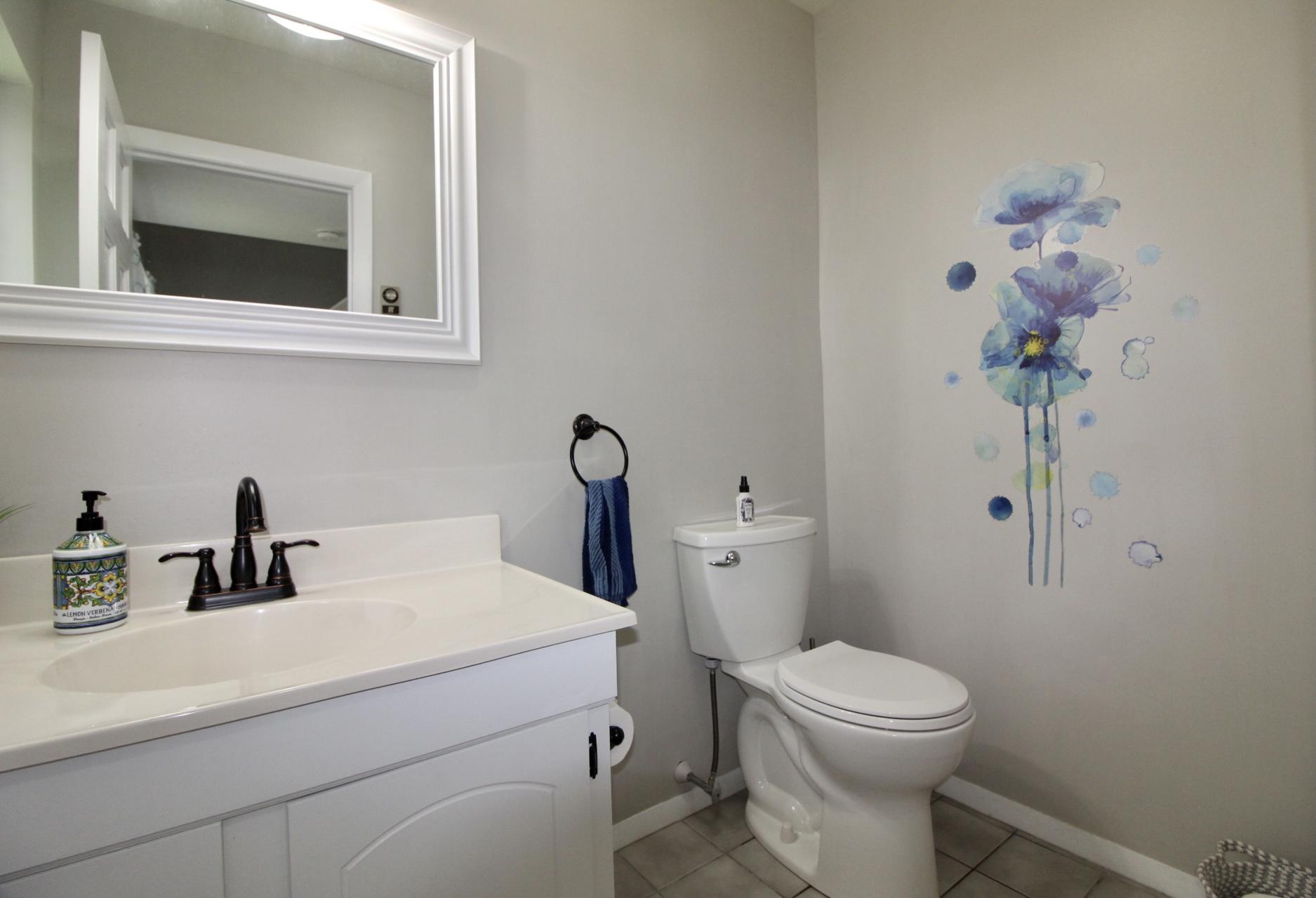 25 Round House Road Bourne, MA 02532 - Photo 12 of 32 a bathroom with a sink a toilet and mirror
