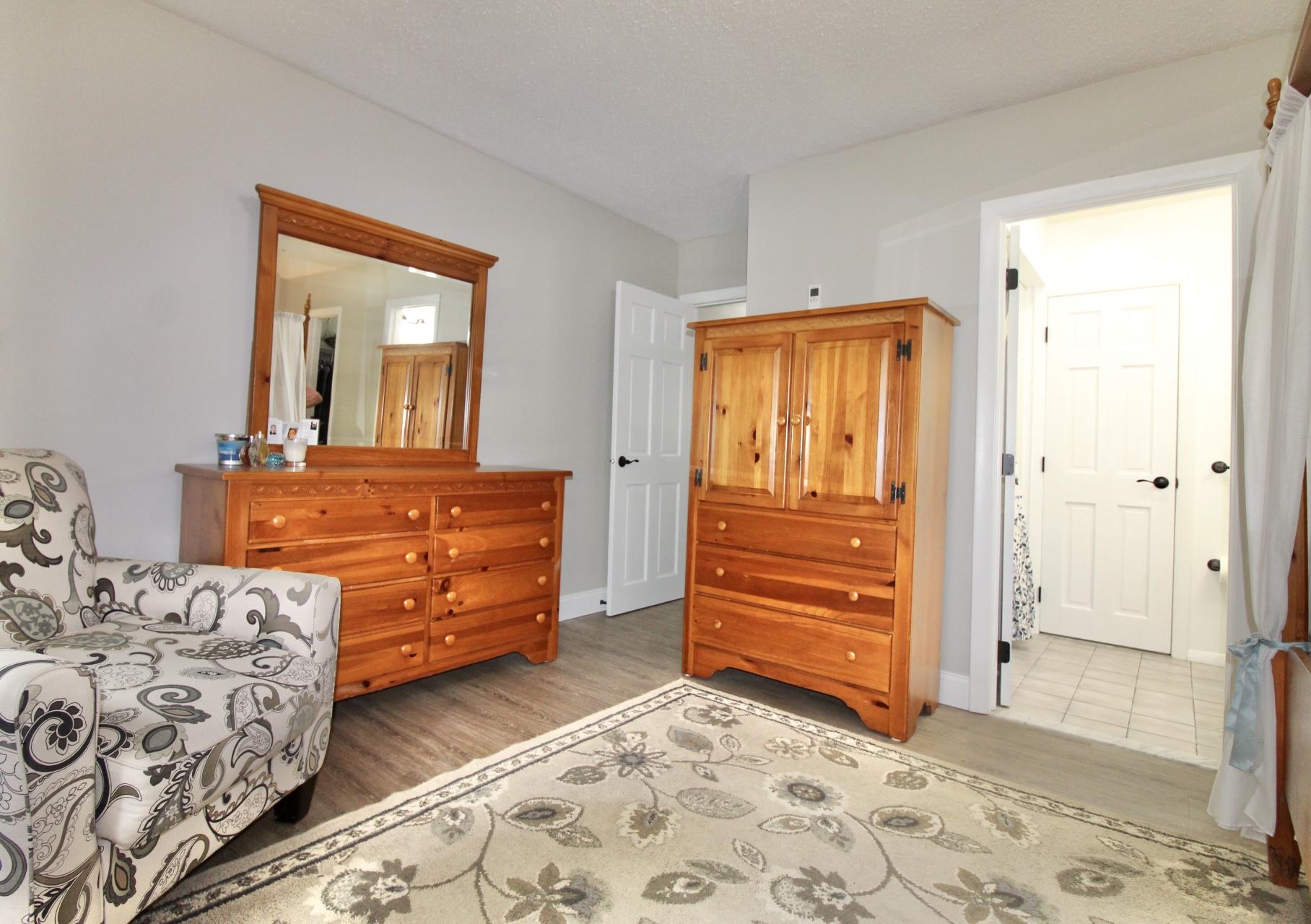 25 Round House Road Bourne, MA 02532 - Photo 17 of 32 a bedroom with a bed and a dresser