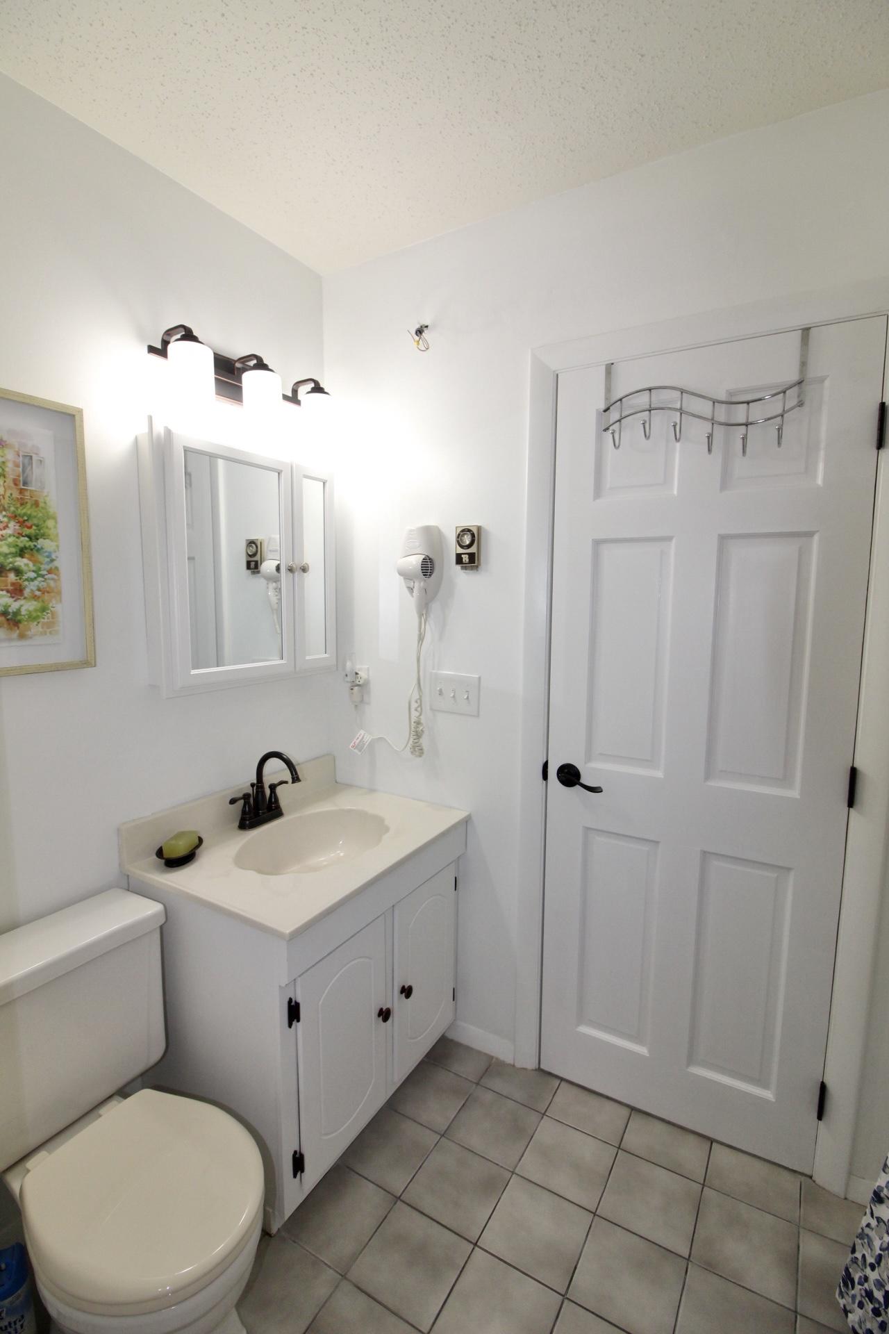 25 Round House Road Bourne, MA 02532 - Photo 19 of 32 a bathroom with a sink toilet and shower