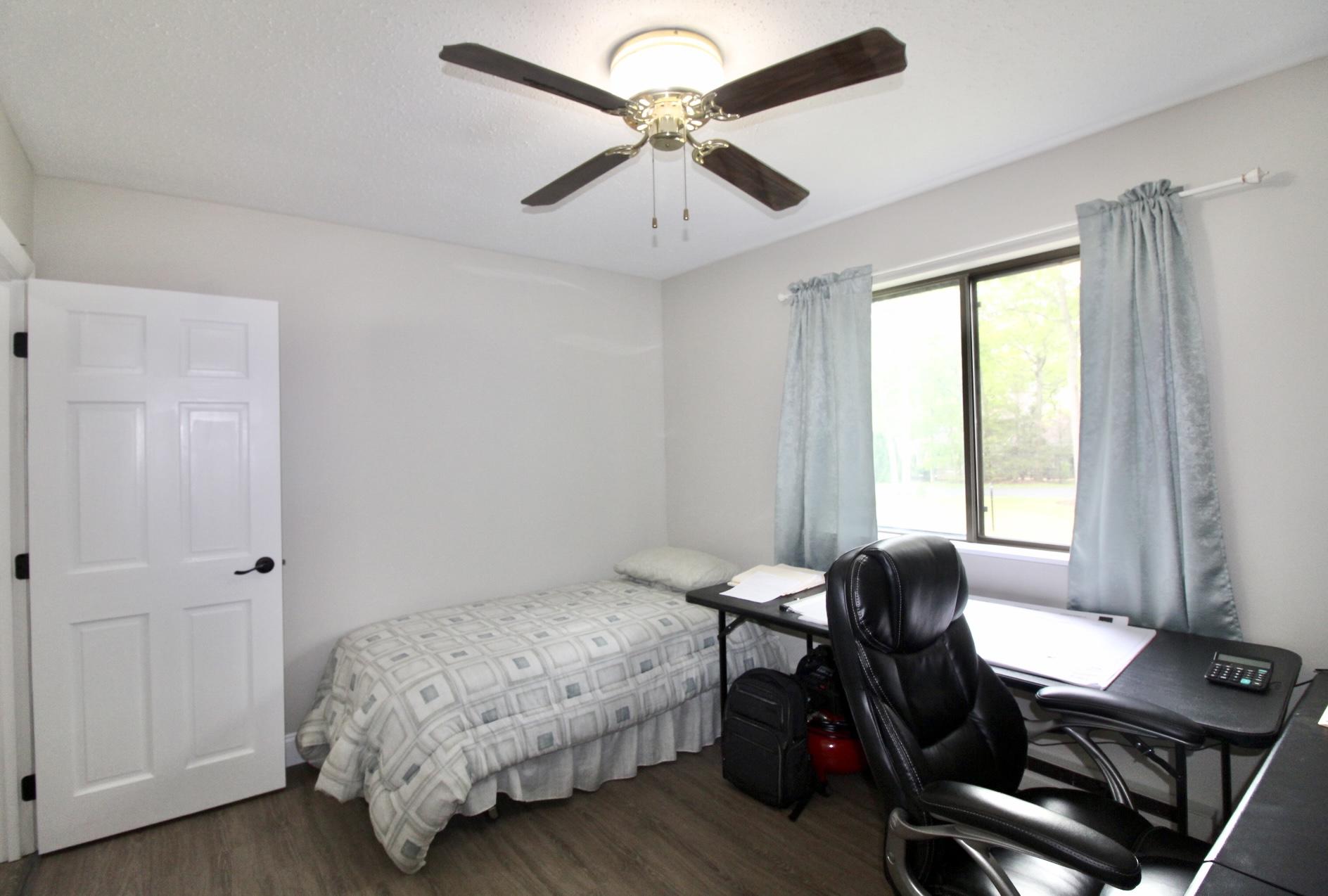 25 Round House Road Bourne, MA 02532 - Photo 22 of 32 a bedroom with a bed and a window