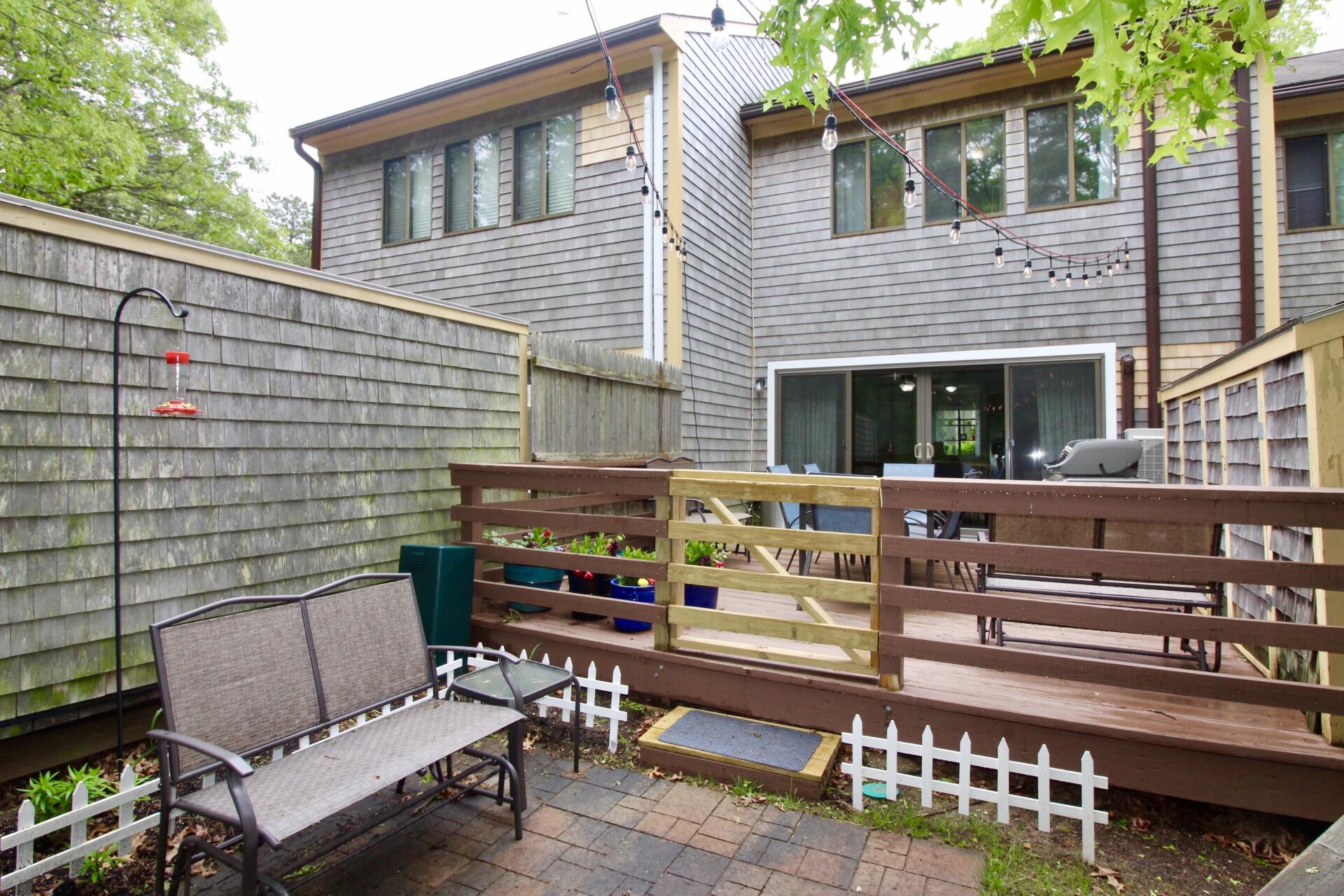 25 Round House Road Bourne, MA 02532 - Photo 25 of 32 a view of a patio with couple of chairs