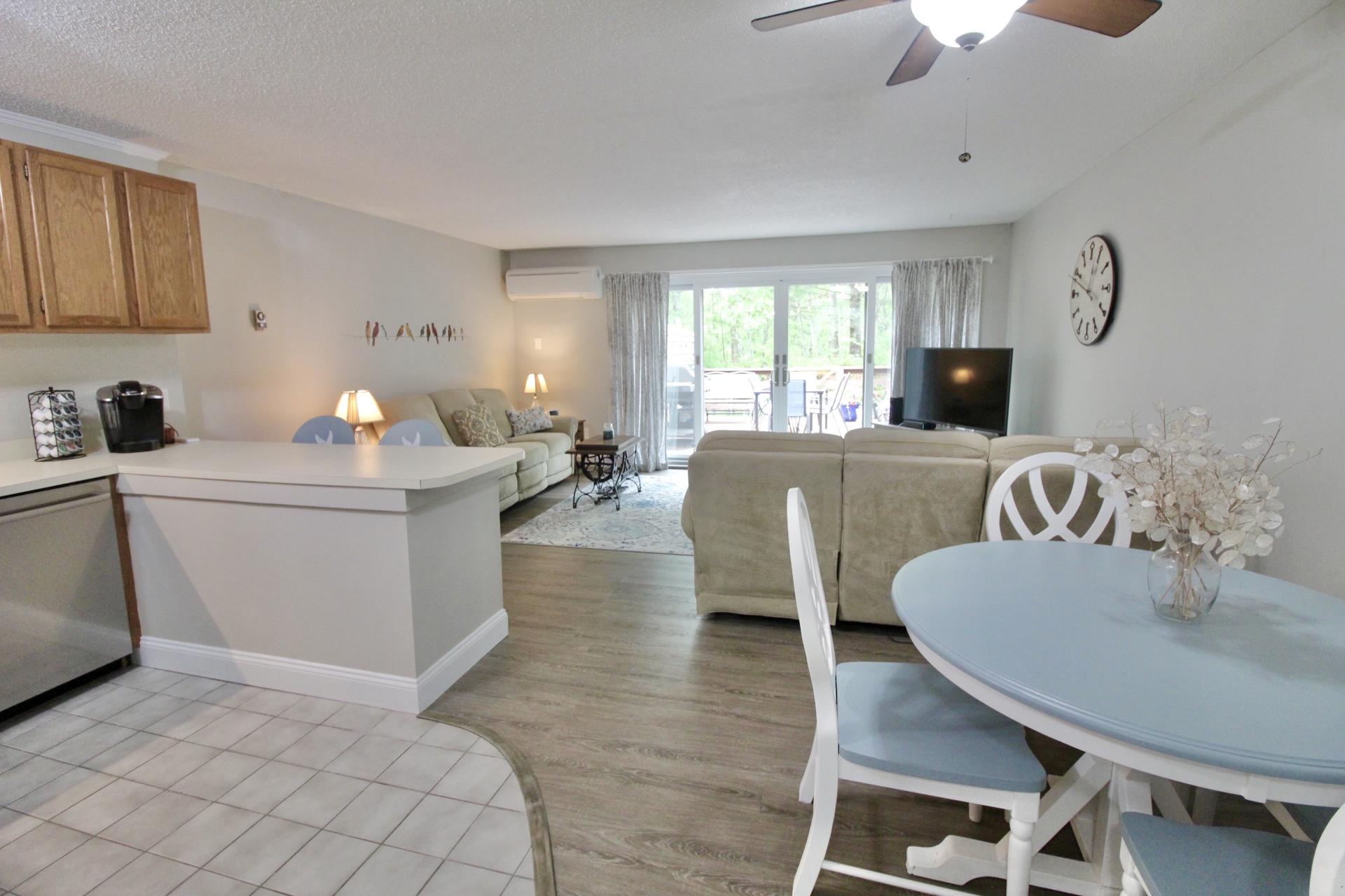 25 Round House Road Bourne, MA 02532 - Photo 6 of 32 a living room with furniture a fireplace and a flat screen tv