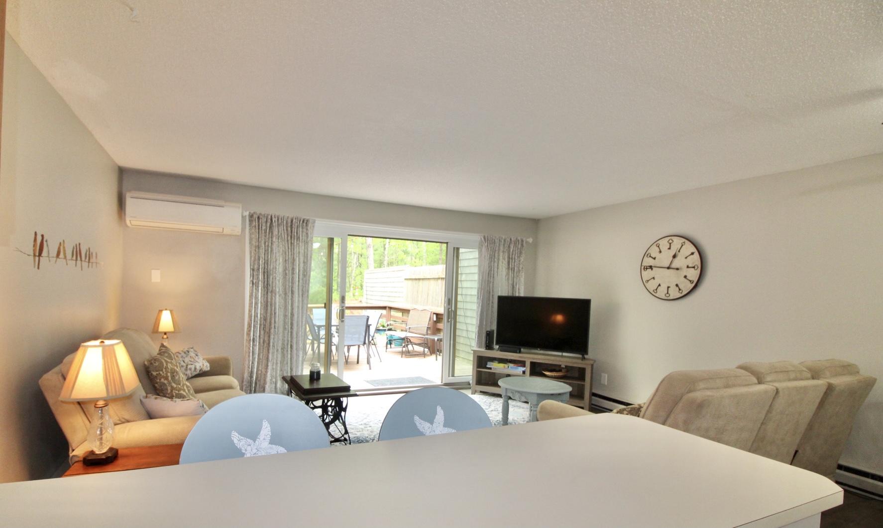 25 Round House Road Bourne, MA 02532 - Photo 8 of 32 a living room with furniture and a flat screen tv