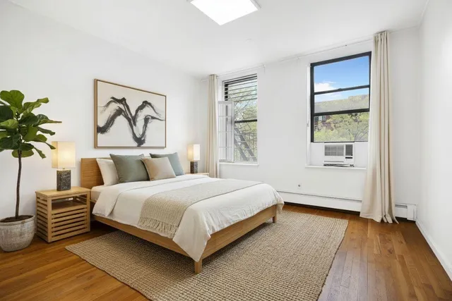 a kitchen with stainless steel appliances and white cabinets