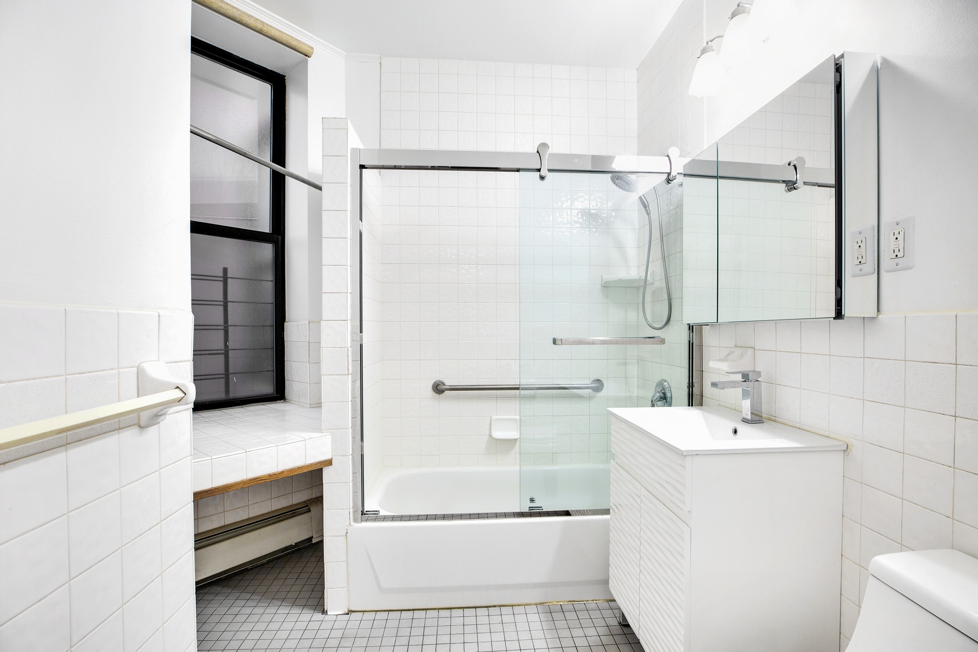 2322 Adam Clayton Powell Jr Boulevard, Unit 3F Manhattan, NY 10030 - Photo 8 of 14 a bathroom with a sink and a shower