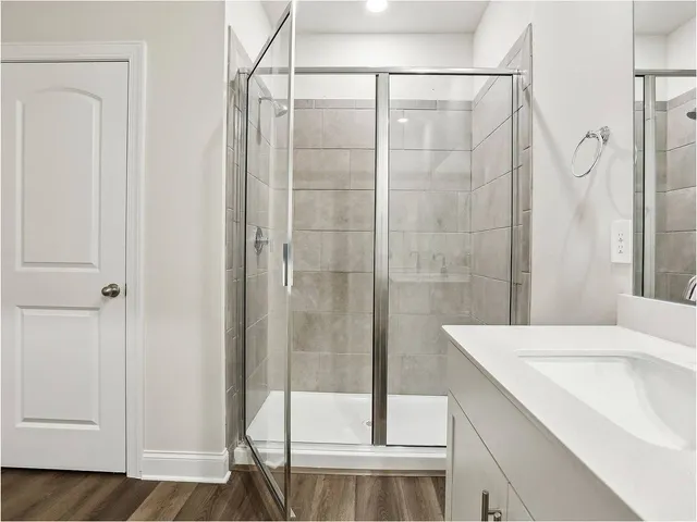 a bathroom with a bathtub and a shower