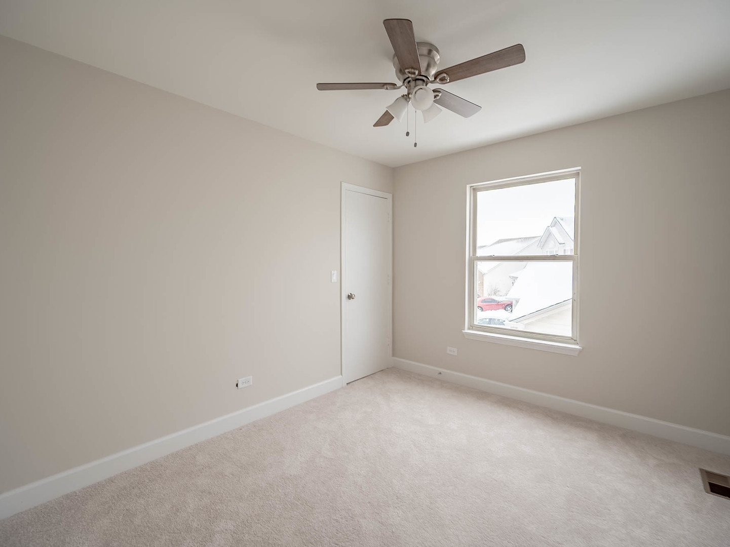 2084 Kentland Drive Romeoville, IL 60446 - Photo 9 of 15 an empty room with a window and a fan