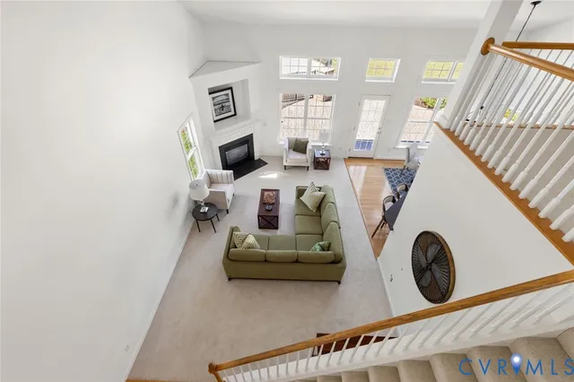 a living room with furniture and a clock