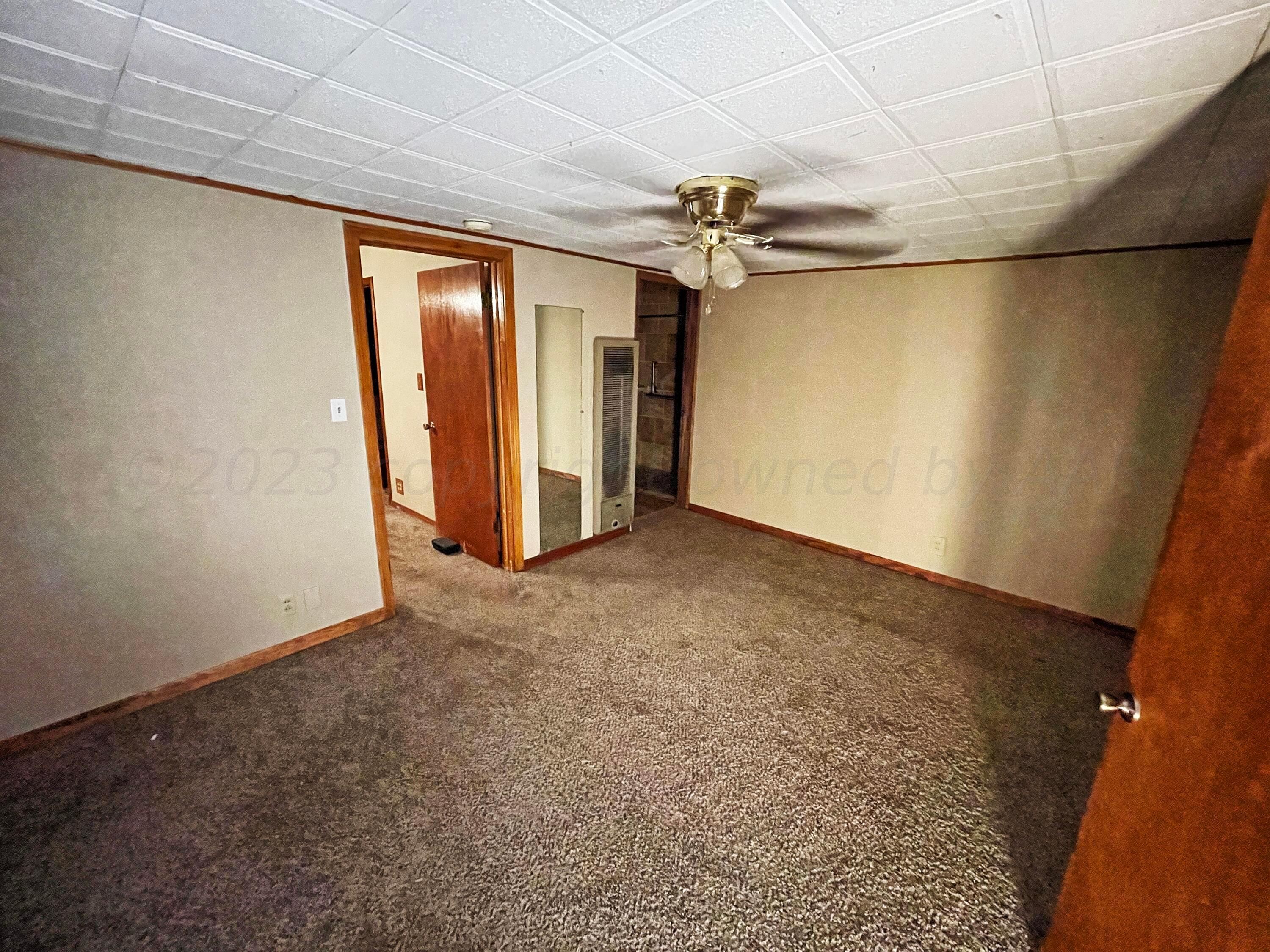 415 Southwest 5th Avenue Perryton, TX 79070 - Photo 13 of 16 an empty room with a empty space