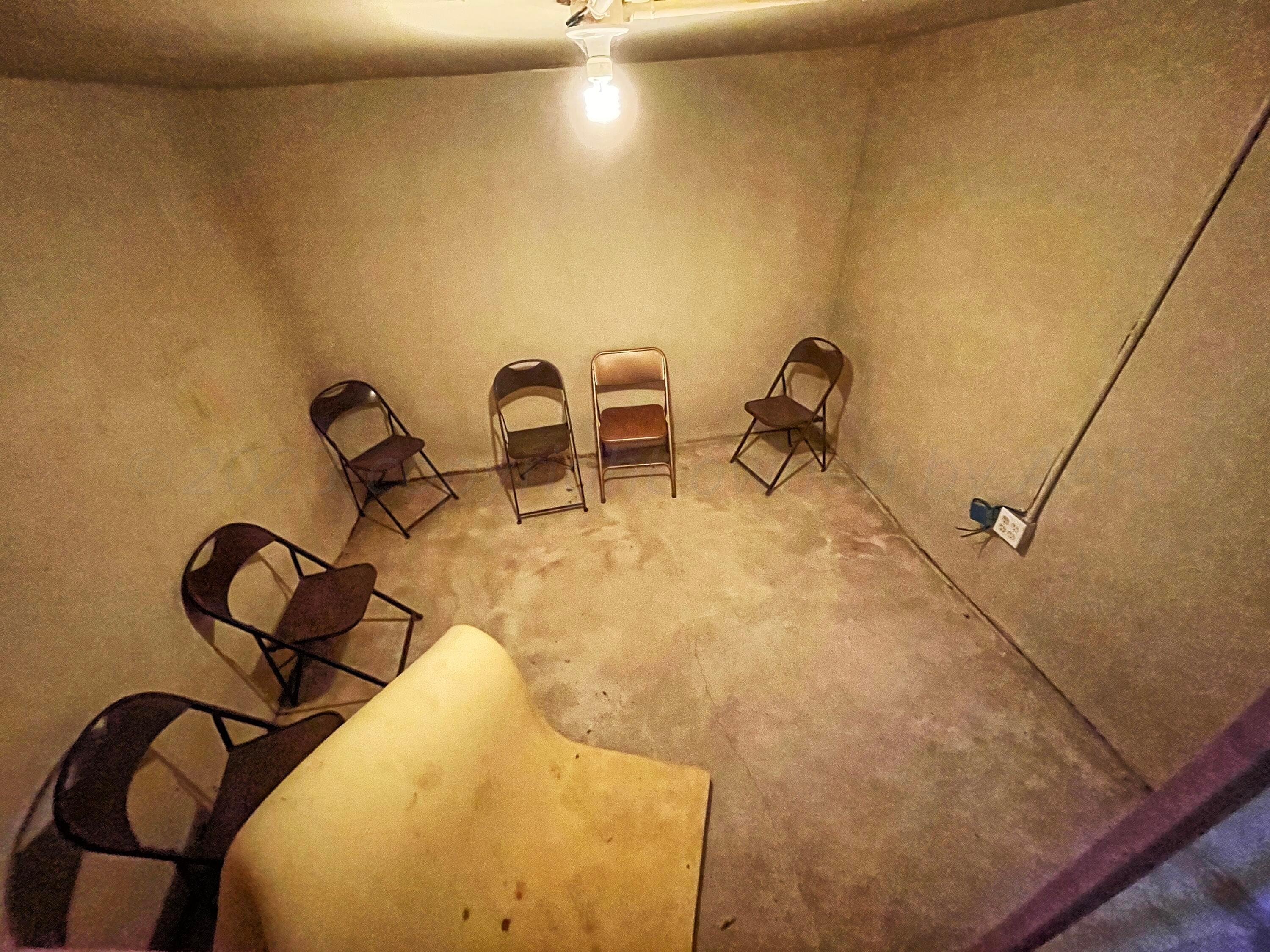 415 Southwest 5th Avenue Perryton, TX 79070 - Photo 16 of 16 a room with gym equipment and a mirror