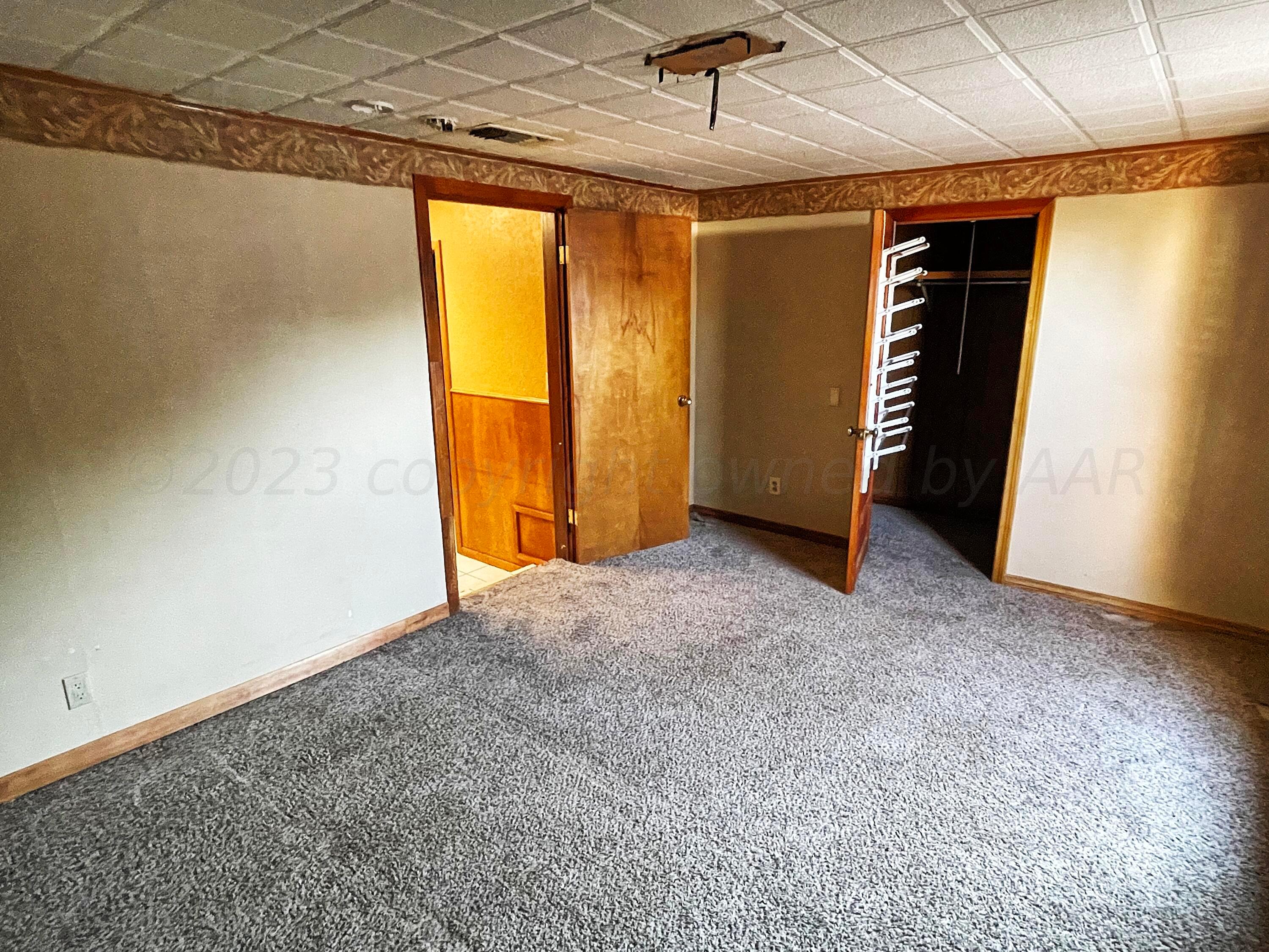 415 Southwest 5th Avenue Perryton, TX 79070 - Photo 10 of 16 a view of an empty room with a window