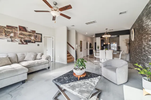 a living room with furniture fireplace and a flat screen tv