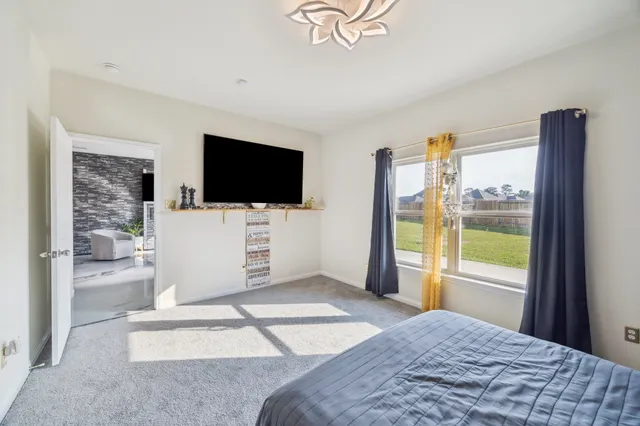 a spacious bathroom with a sink and a mirror