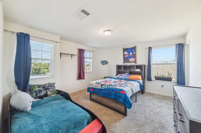 a room with a bed and window