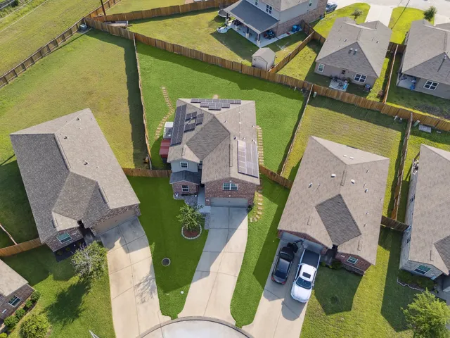 an aerial view of a house with a garden