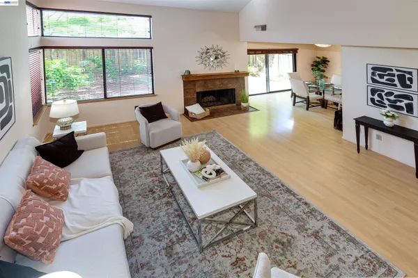 a living room with furniture and a fireplace
