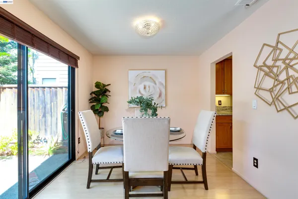 a view of a livingroom with furniture and a potted plant