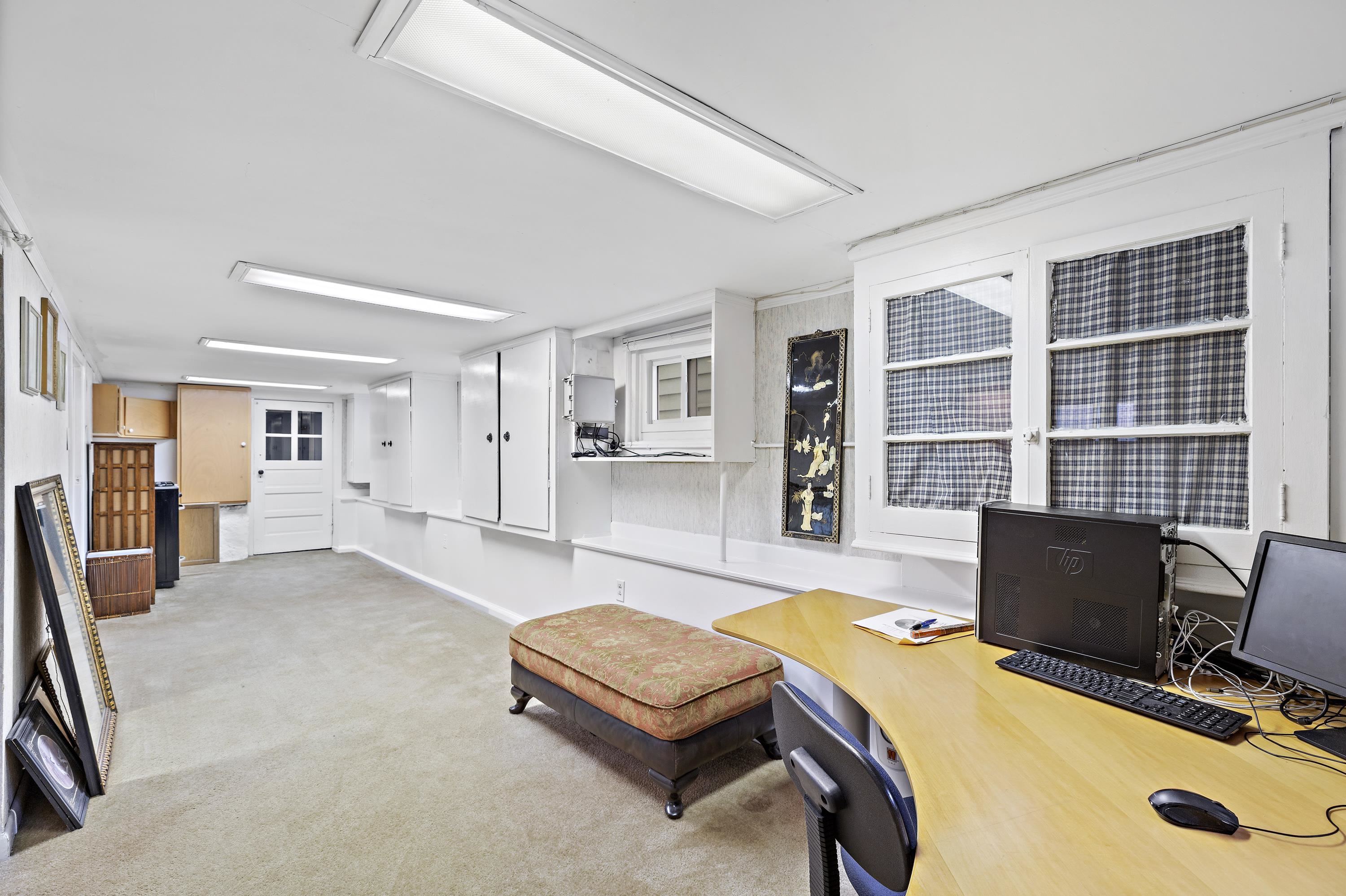 414 North 8th Street Fairview, NJ 07022 - Photo 16 of 22 a living room with furniture and a flat screen tv