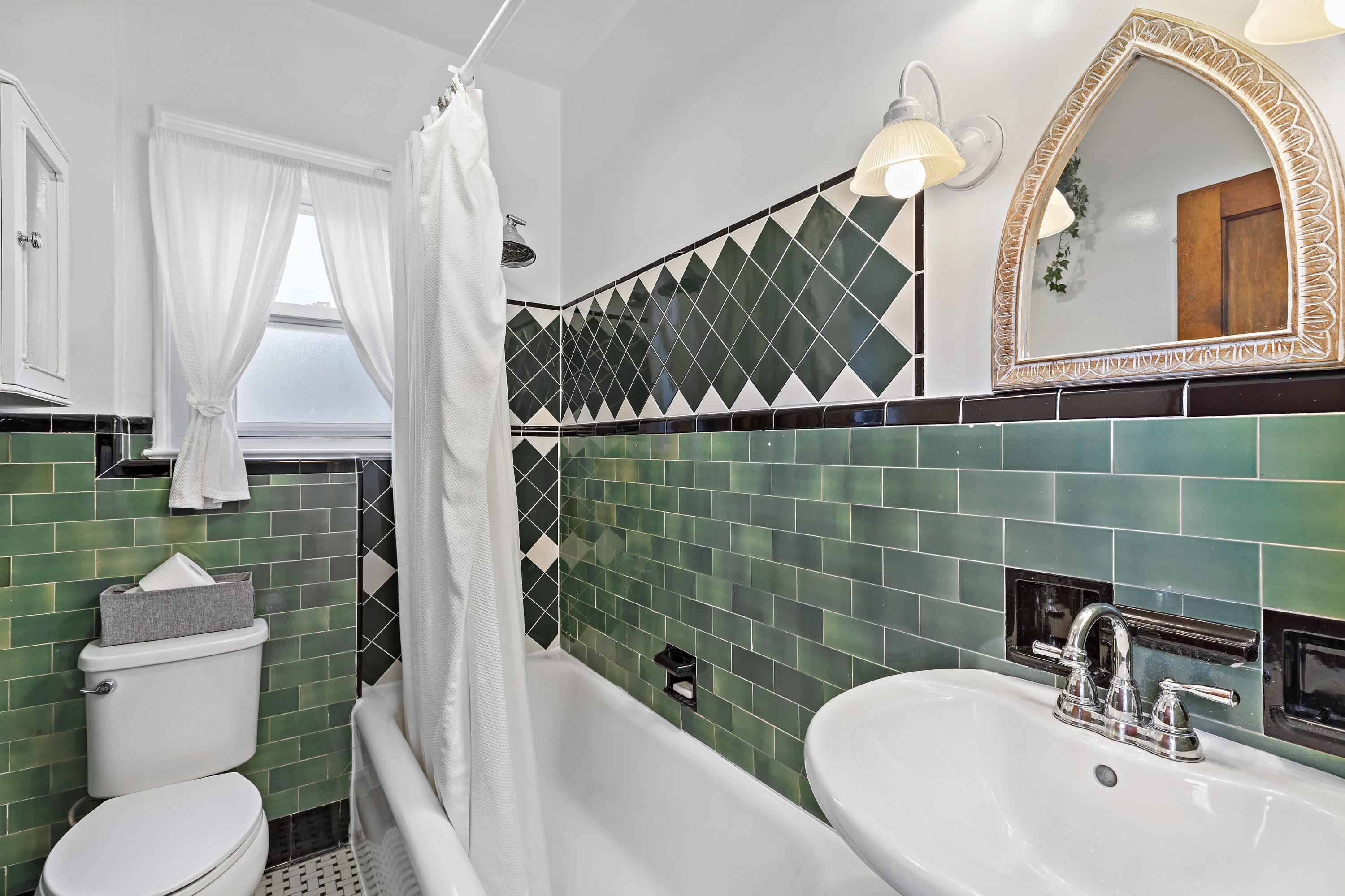 414 North 8th Street Fairview, NJ 07022 - Photo 20 of 22 a bathroom with a sink a toilet and shower