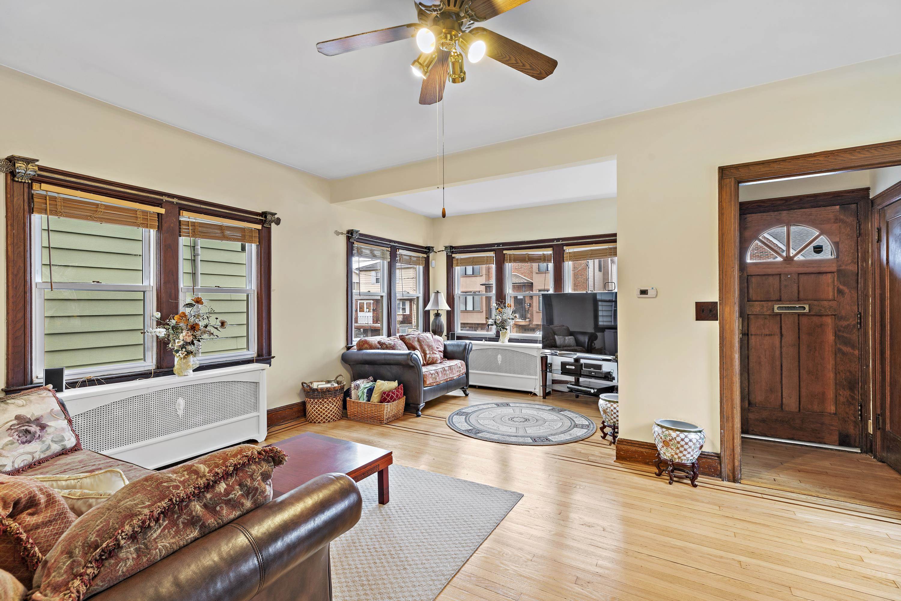 414 North 8th Street Fairview, NJ 07022 - Photo 4 of 22 a living room with furniture and wooden floor