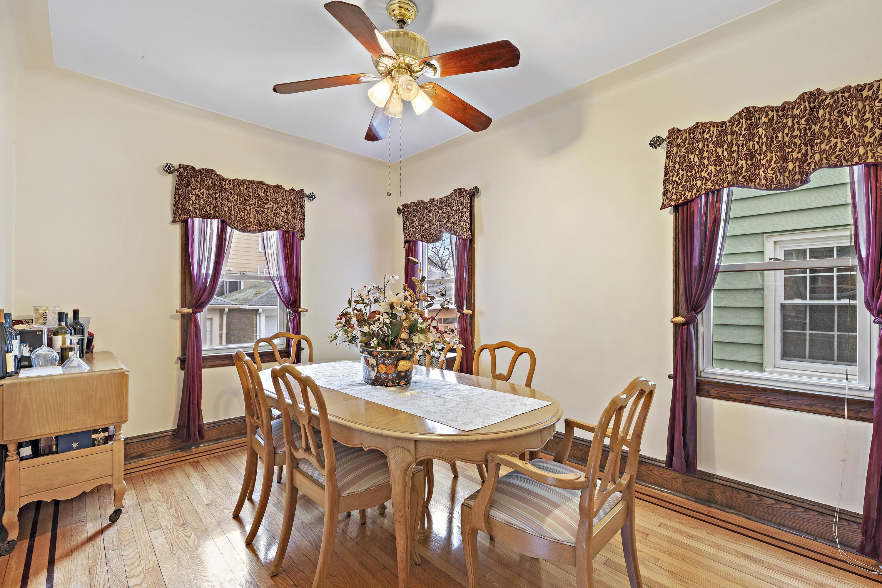 414 North 8th Street Fairview, NJ 07022 - Photo 8 of 22 a view of a dining room with furniture and a chandelier