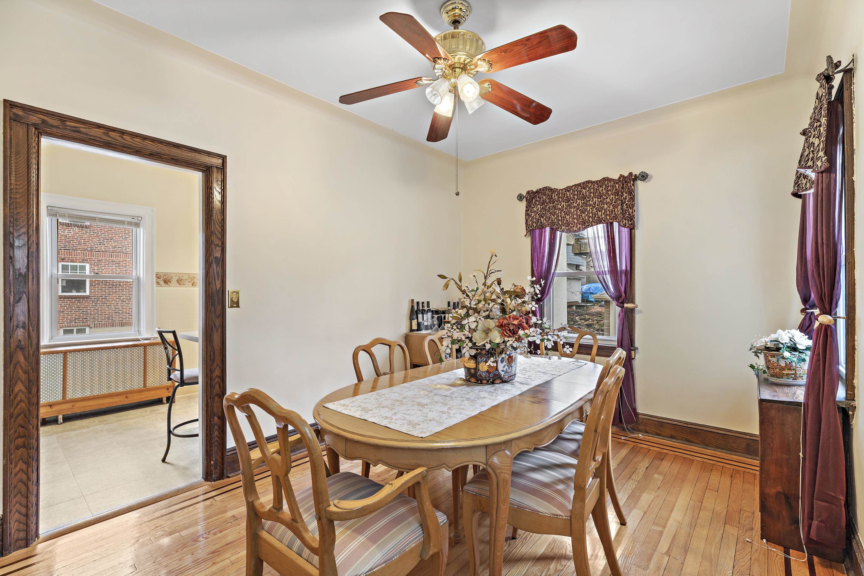 414 North 8th Street Fairview, NJ 07022 - Photo 9 of 22 a view of a dining room with furniture and a chandelier fan