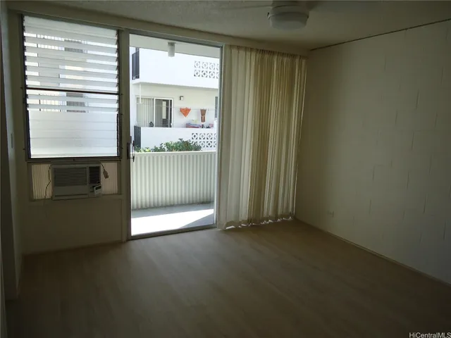 a view of an empty room with a window
