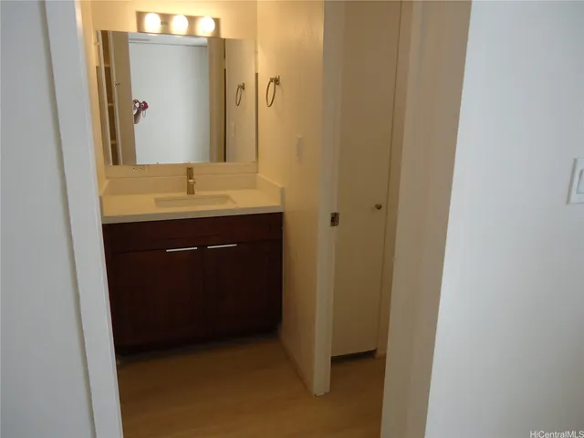 a bathroom with a sink and a mirror