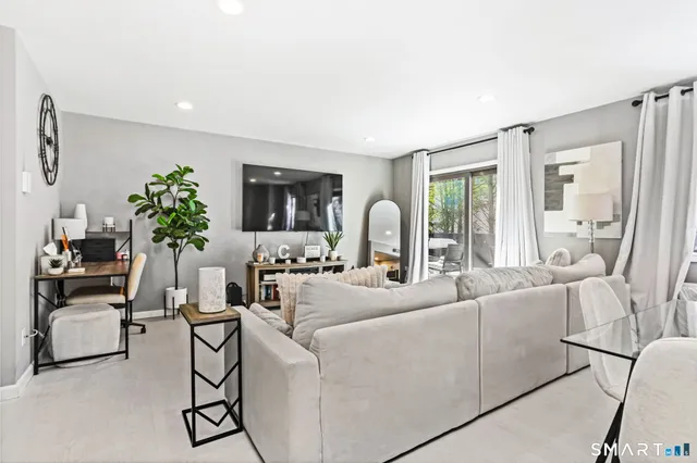 a dining room with furniture and window