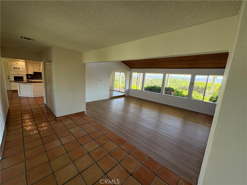 1905 Vista Del Norte Fallbrook, CA 92028 - Photo 15 of 29 wooden floor in an empty room with a window