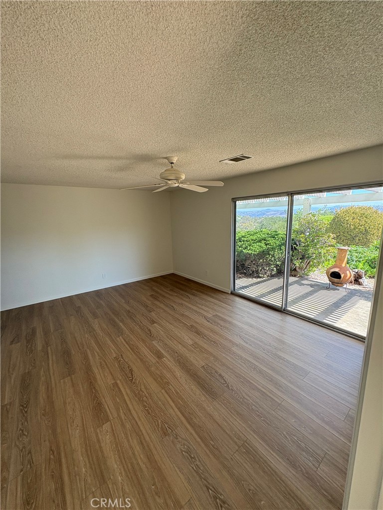 1905 Vista Del Norte Fallbrook, CA 92028 - Photo 18 of 29 wooden floor in an empty room with a window