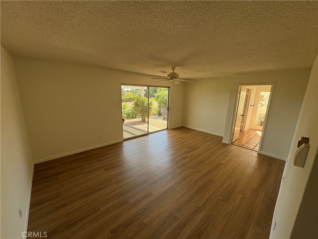 1905 Vista Del Norte Fallbrook, CA 92028 - Photo 21 of 29 an empty room with wooden floor and windows